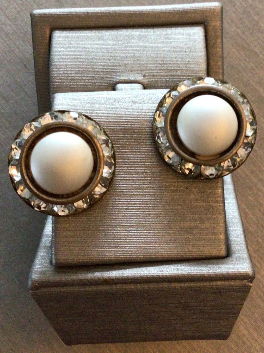 Vintage 1950’s white button clip on earrings surrounded by rhinestones